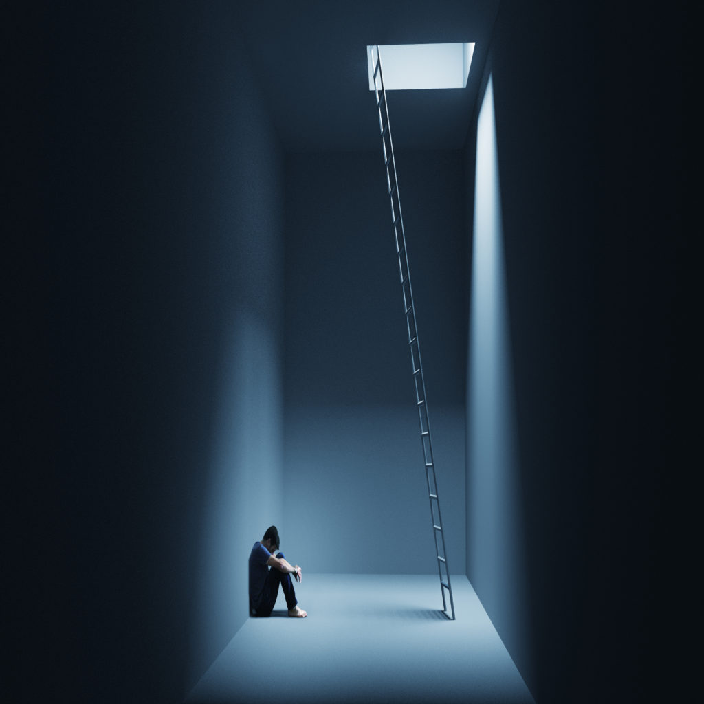 A person sits on the floor of a dark room with knees drawn up, a ladder leading to a lit opening in the ceiling above.