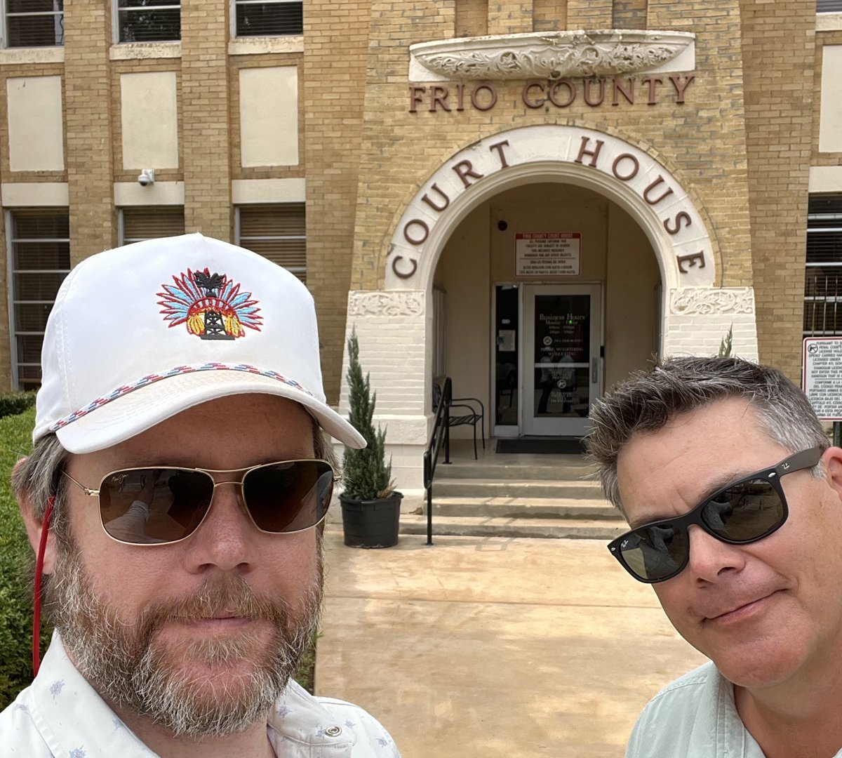Gates and Chris Yonker outside the Frio County Court House entrance in Pearsall, Texas
